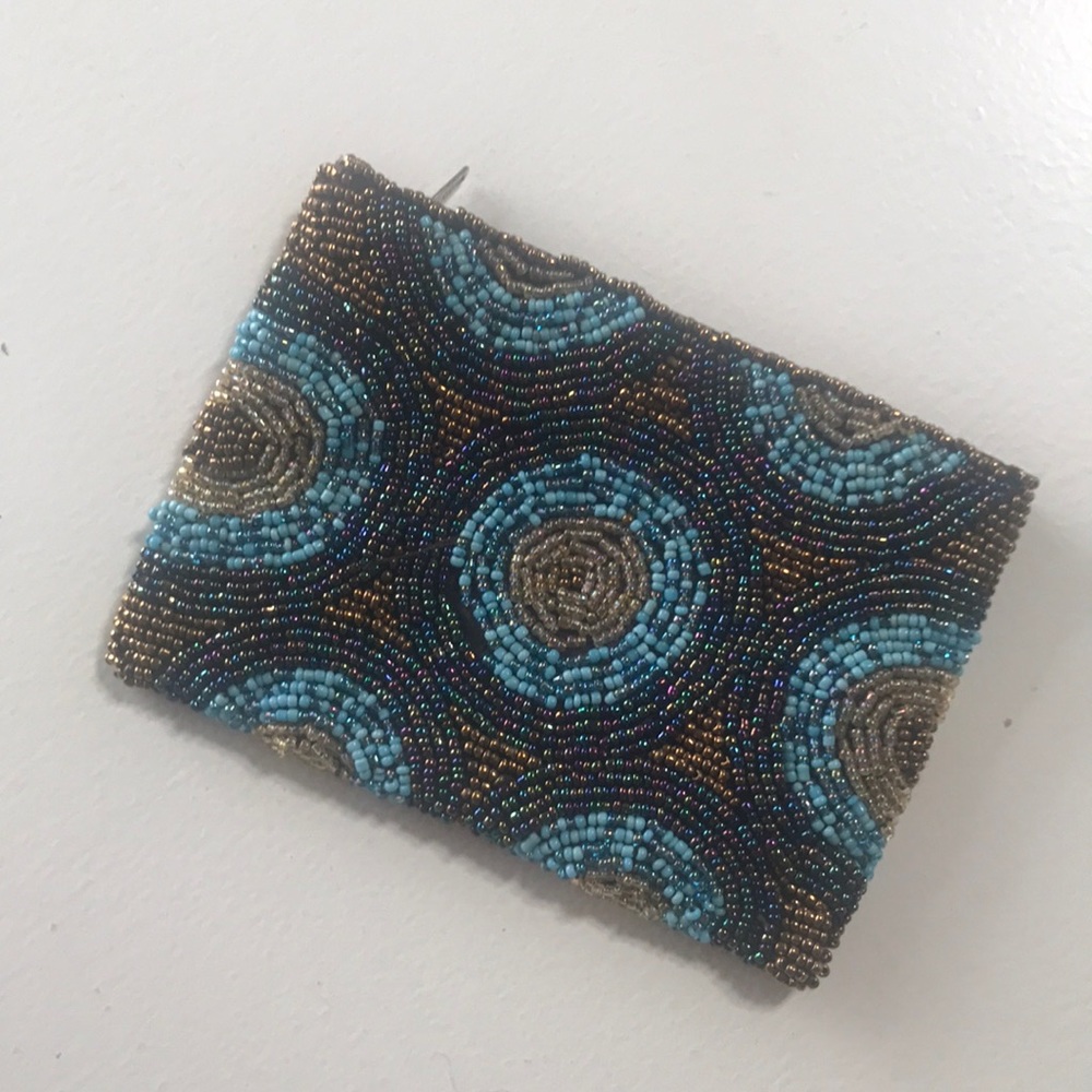 Beaded coin purse or makeup pouch.